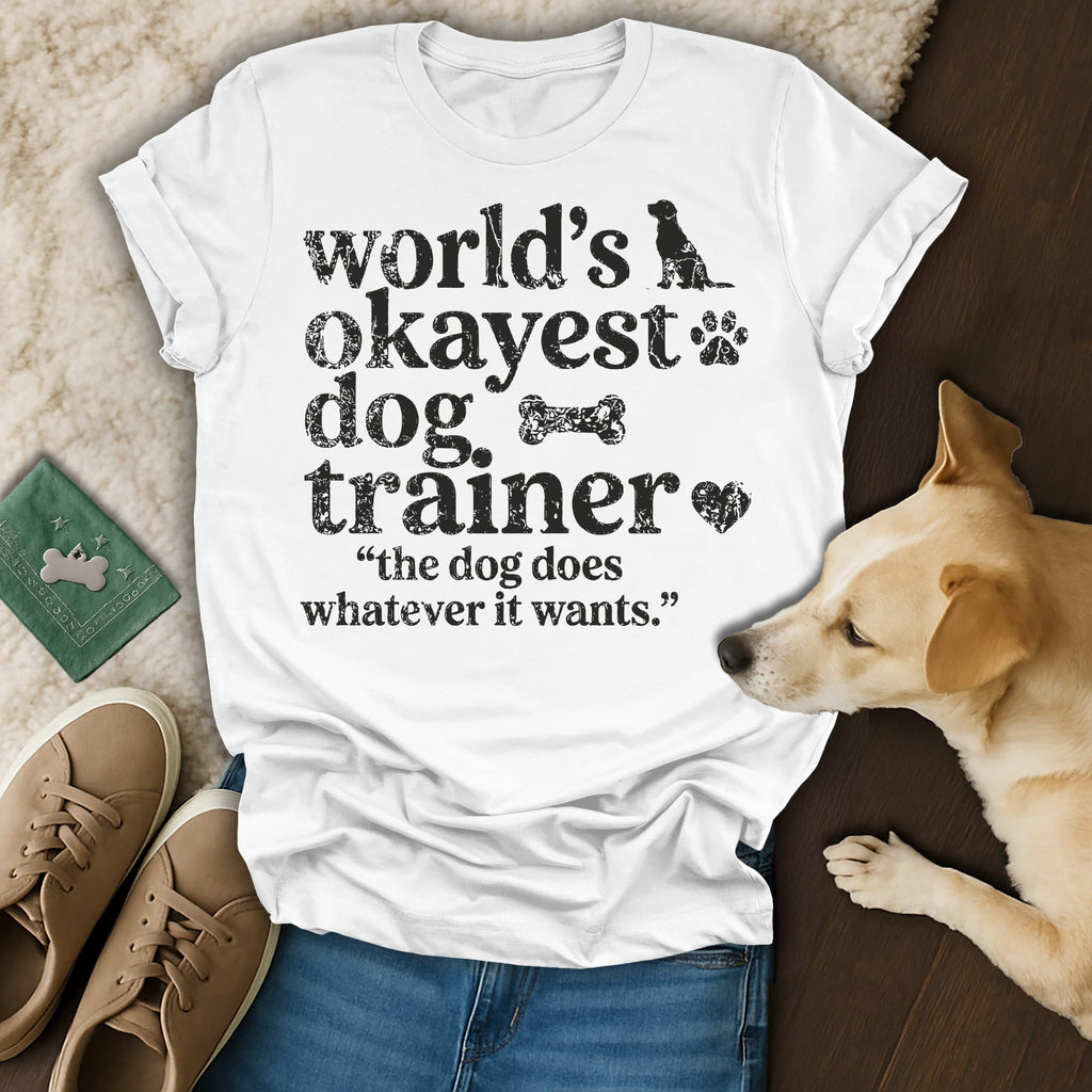 White t-shirt with "World's okayest dog trainer" and a dog graphic.