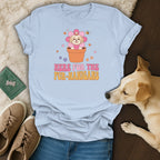 Light blue t-shirt with a cartoon dog in a flower pot and text "HERE FOR THE FUR-NANIGANS".