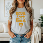 Grey t-shirt with "Rescue. Love. Repeat." and a heart-paw print.