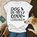 White t-shirt with "Dog is my love language" text and paw print graphic.