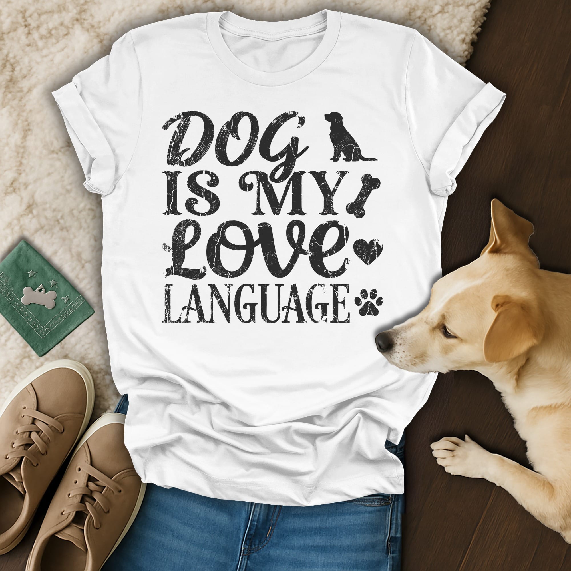 White t-shirt with "Dog is my love language" text and paw print graphic.