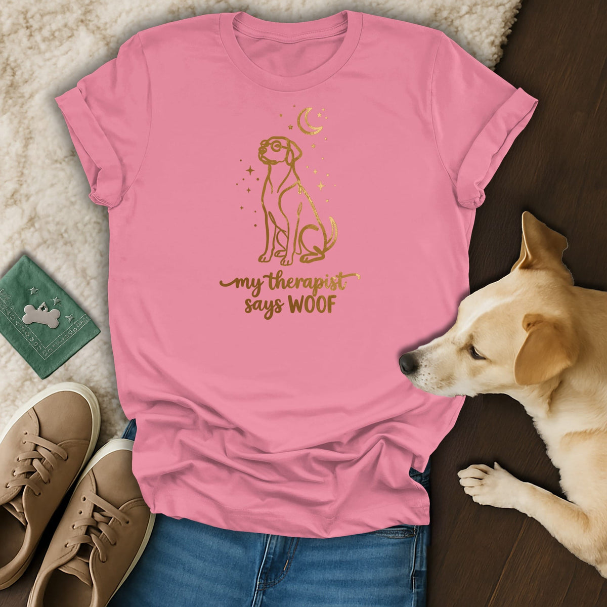 Pink t-shirt with gold graphic of a dog and text that says "my therapist says WOOF".