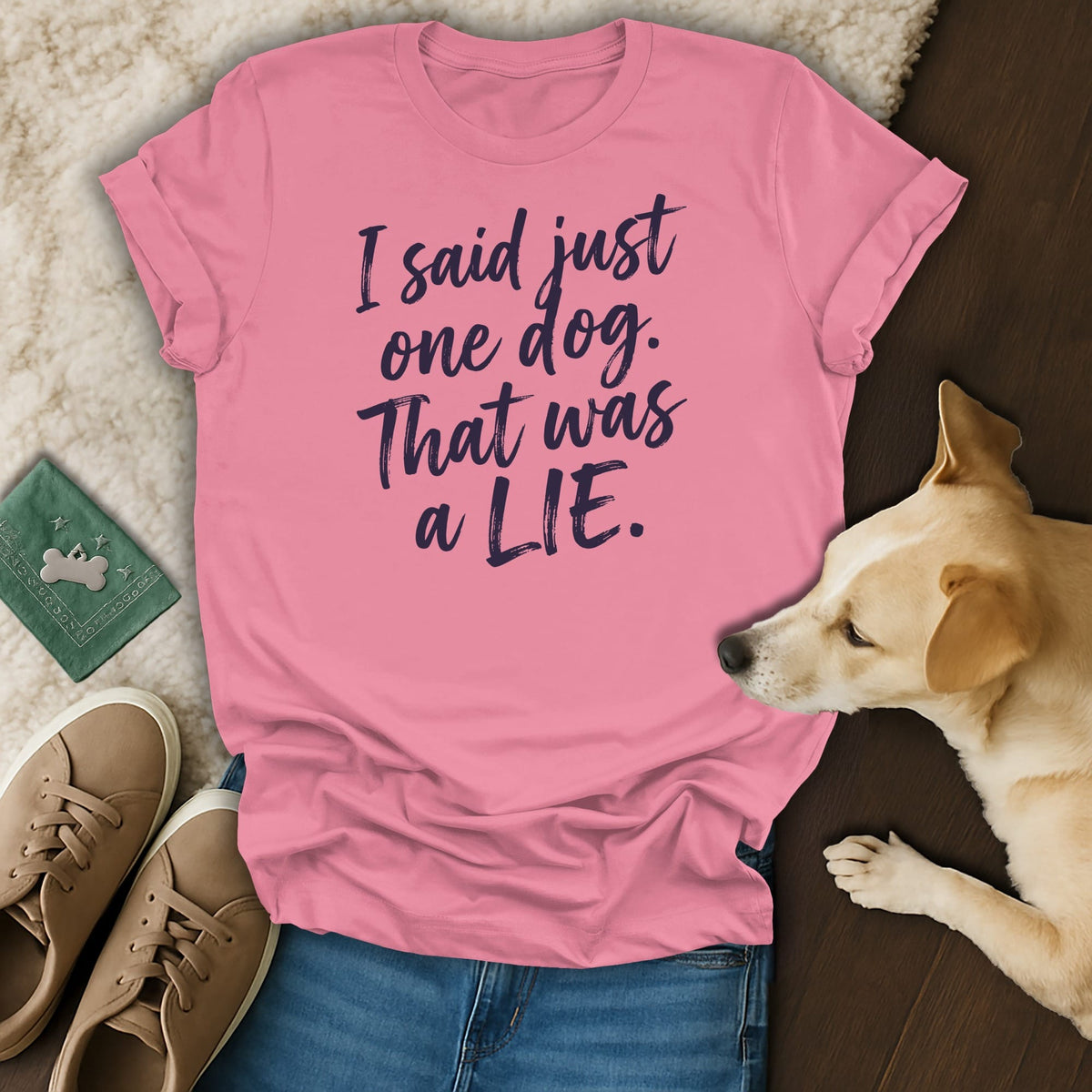 Pink t-shirt with dark blue text that reads "I said just one dog. That was a LIE."