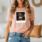 Dog wearing sunglasses is poured a drink in a polaroid image on a t-shirt.