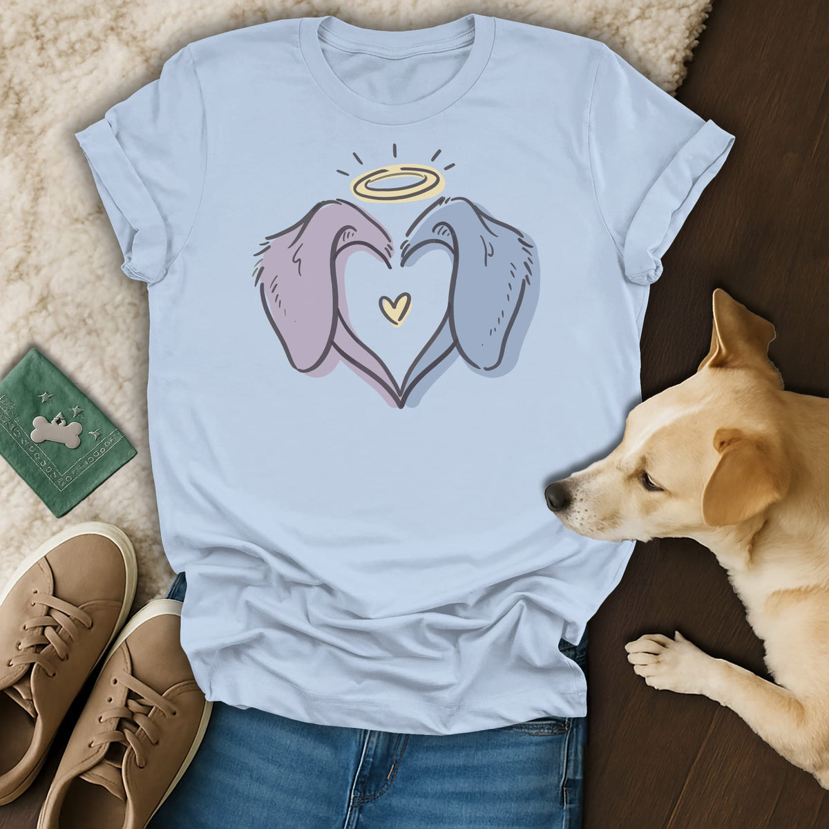 Light blue t-shirt with line art of two dog heads forming a heart and a halo.