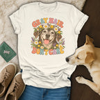 A cream t-shirt with a retro-style senior dog graphic reading Gray Hair Don't Care.