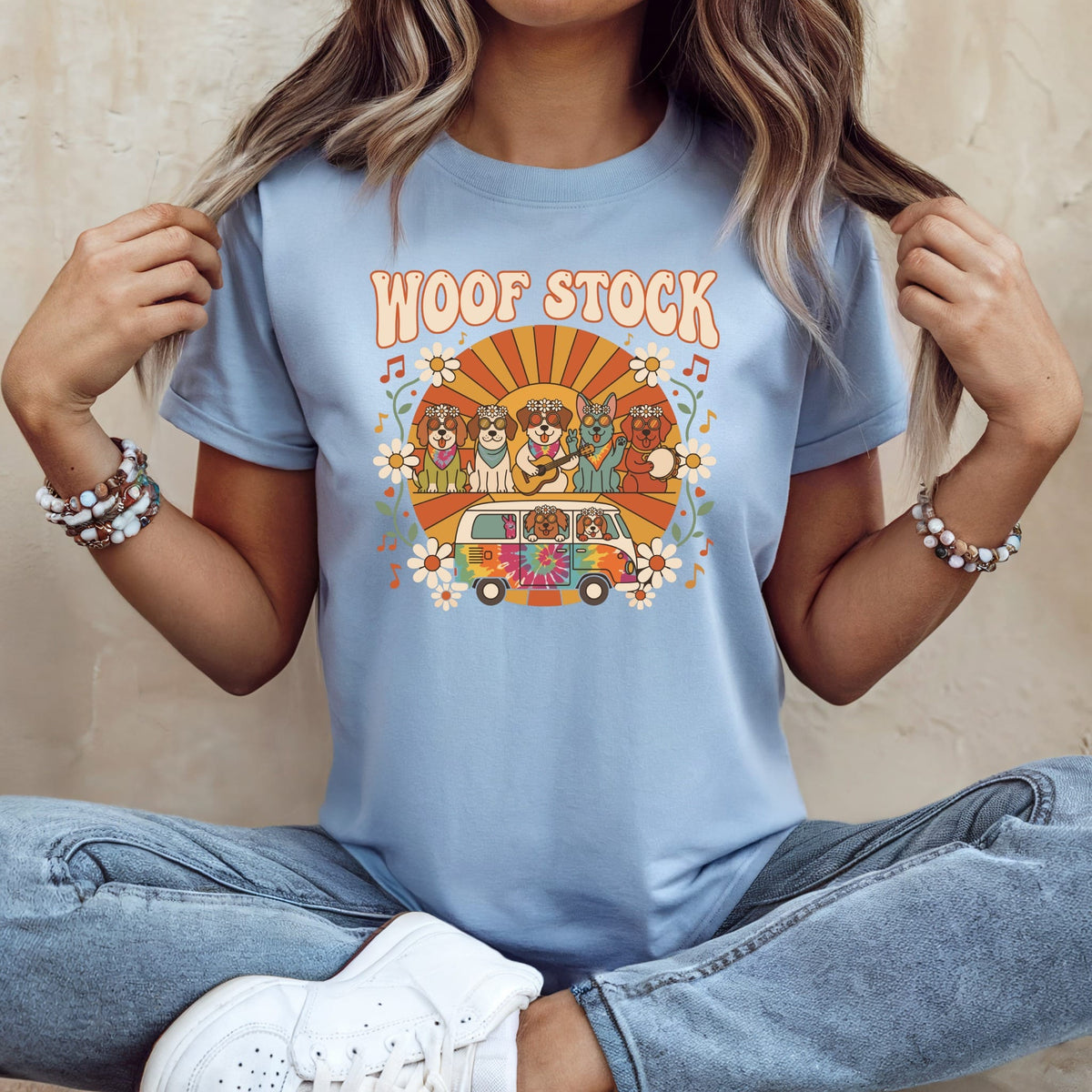 T-shirt with "Woof Stock" text and dogs in a tie-dye van.