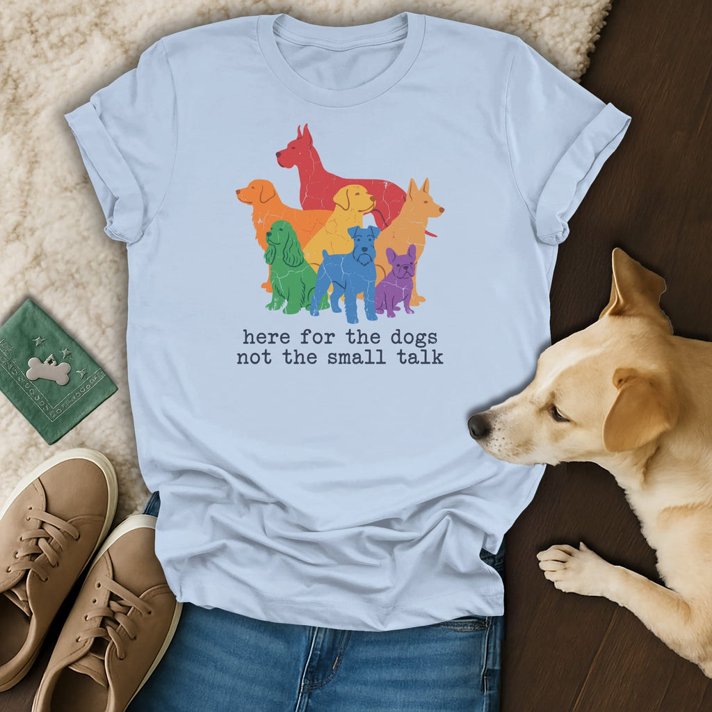 Light blue t-shirt with rainbow dogs graphic and text saying "here for the dogs not the small talk".