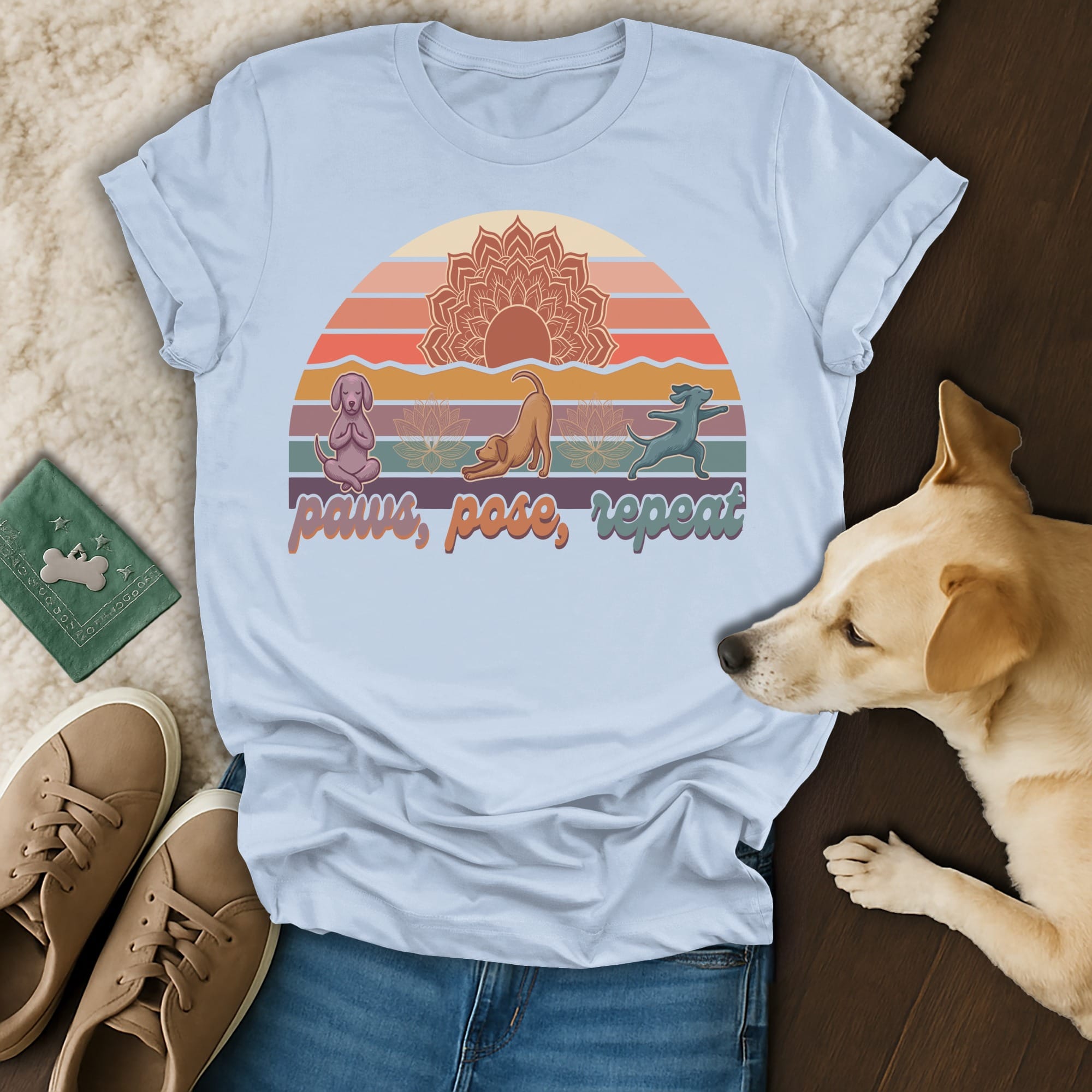 T-shirt with dogs in yoga poses against a sunset and lotus flower design.