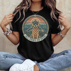Black t-shirt with a circular nautical graphic featuring a dog wearing a captain's hat, text reads "ALL PAWS ON DECK."