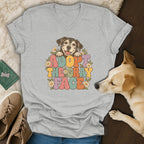 Gray V-neck t-shirt featuring a retro graphic that says Adopt the Gray Face with a happy senior dog and flowers.