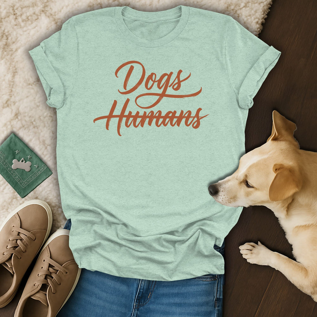 Light green t-shirt with "Dogs Humans" text in orange script.