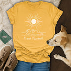 Yellow t-shirt with dog enjoying sun graphic and "Treat Yourself." text.