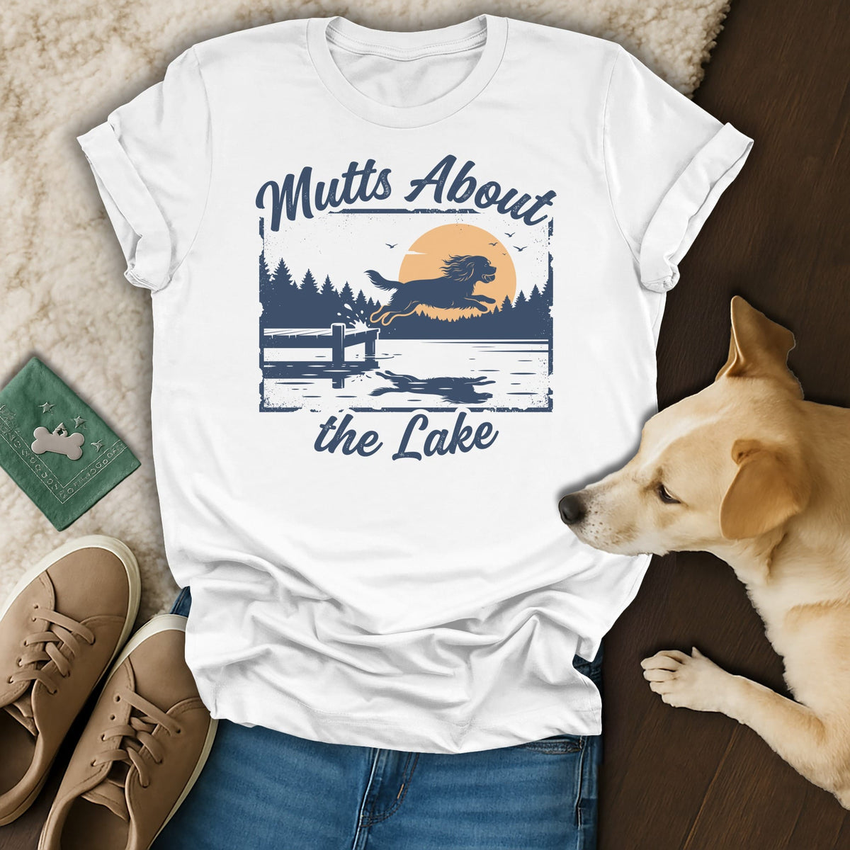 White t-shirt with "Mutts About the Lake" text and a dog jumping into a lake graphic.