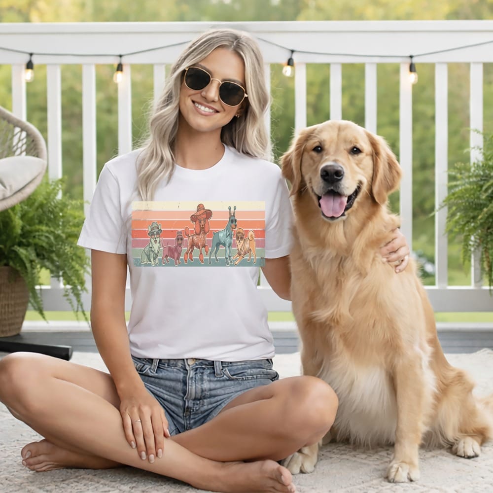 Woman with golden retriever wearing t-shirt with colorful dog graphic.