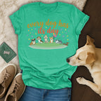 Green t-shirt with cartoon dogs, balloons, and text "every dog has its day".