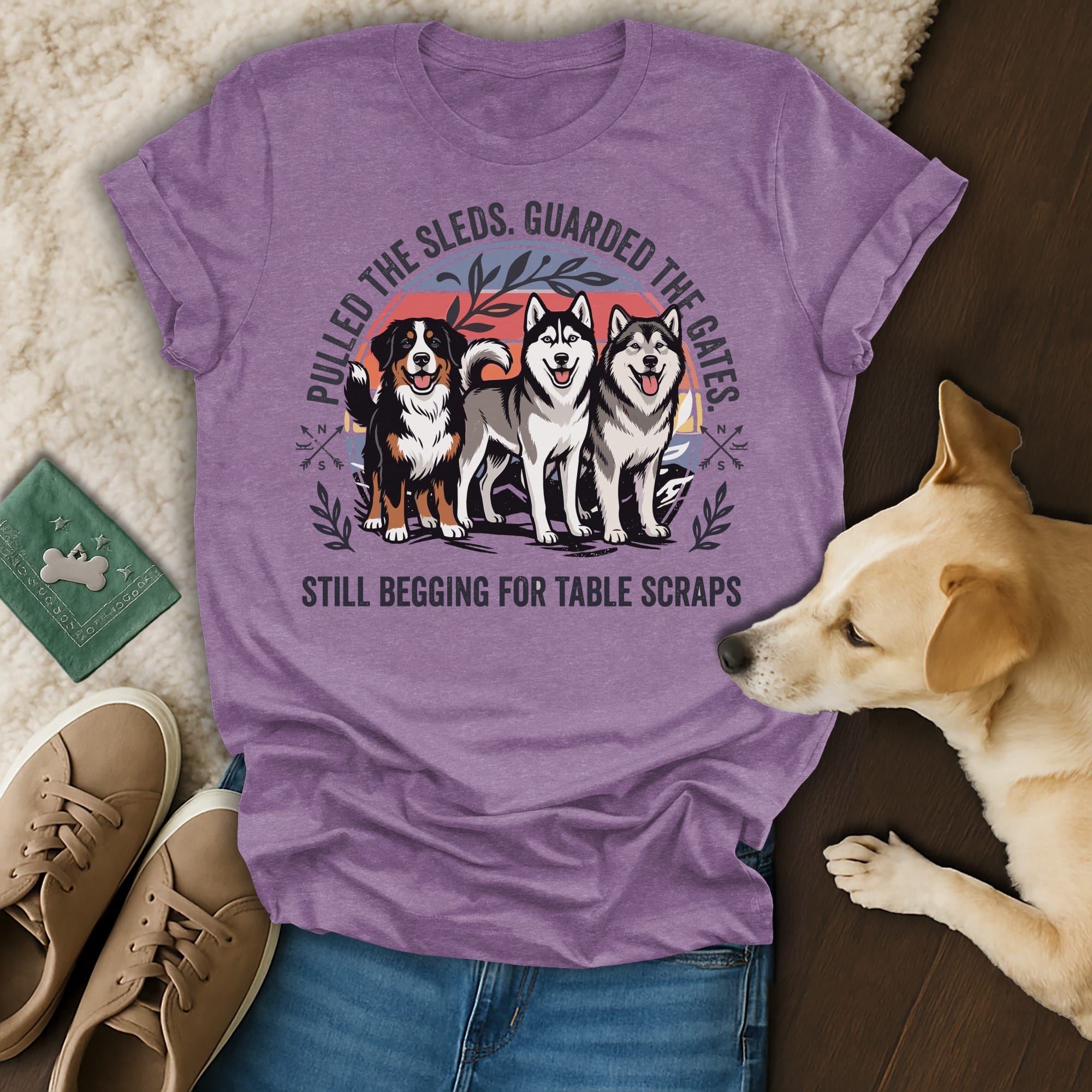 Purple t-shirt with three dogs and text: "Pulled the sleds. Guarded the gates. Still begging for table scraps."