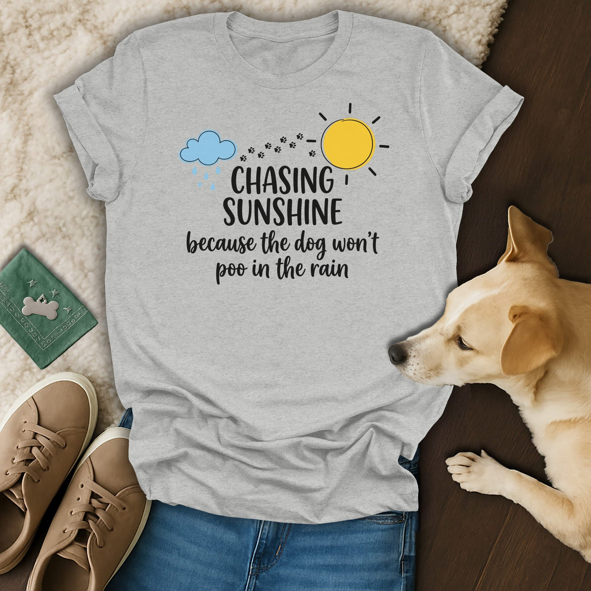 Gray t-shirt with "Chasing Sunshine because the dog won't poo in the rain" text.