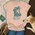 Peach t-shirt with teal dog and palm tree graphic and text "Island Heart DOG SOUL."