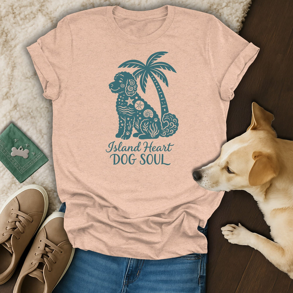 Peach t-shirt with teal dog and palm tree graphic and text "Island Heart DOG SOUL."