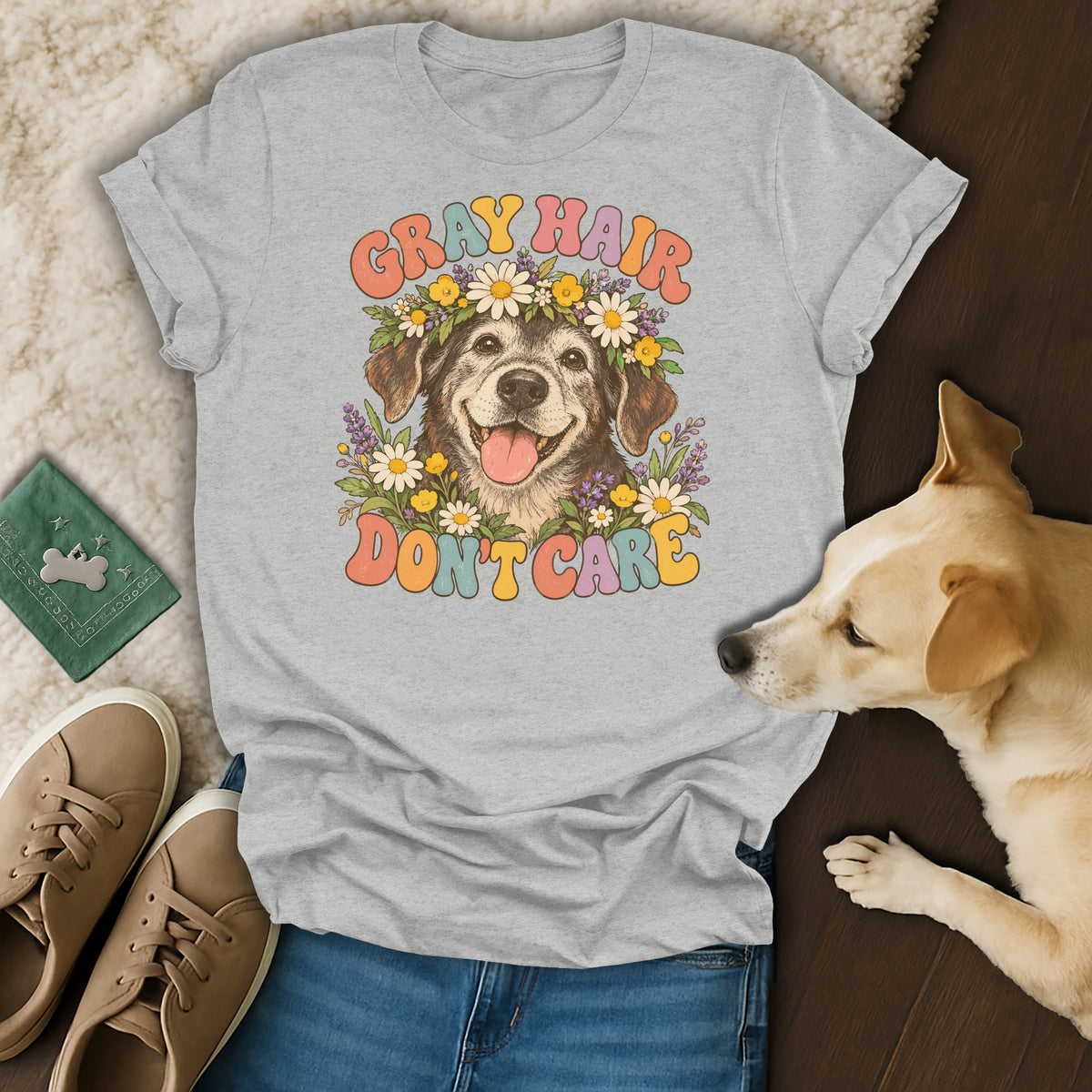 Heather gray t-shirt featuring a retro graphic of an older dog wearing a flower crown, with the text Gray Hair Don't Care.