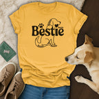 Yellow t-shirt with "Bestie" text and dog graphic, paired with jeans and sneakers.