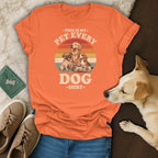 Orange t-shirt with "This is my pet every dog" graphic and a dog.