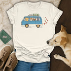 White t-shirt with cartoon dogs in a blue van and red hearts.