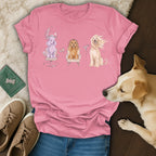 Pink t-shirt with three illustrated dogs getting pampered at a salon.