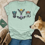 Mint t-shirt with four dog heads wearing hats in a circular pattern.