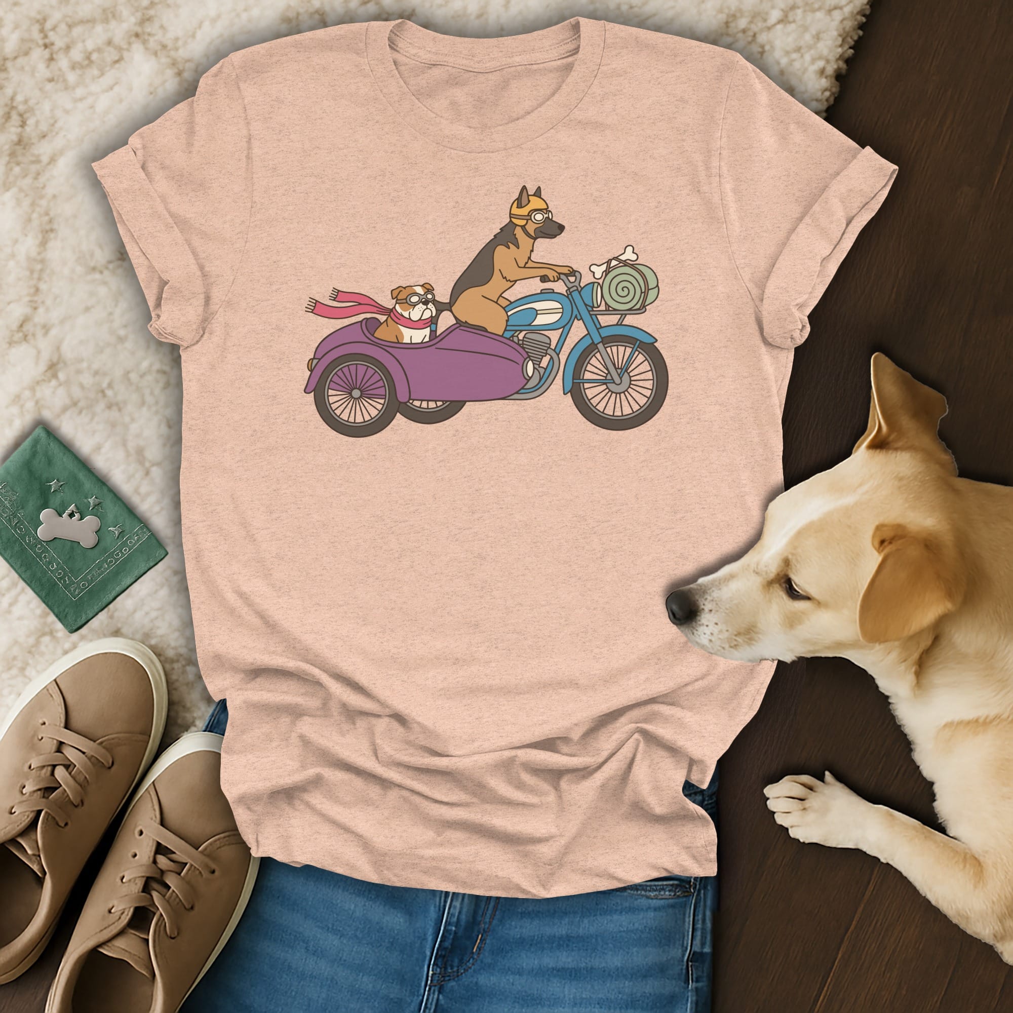 Peach t-shirt with cartoon dogs riding a motorcycle with a sidecar.