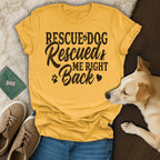 Yellow t-shirt with "Rescue Dog Rescued Me Right Back" text and dog graphic.