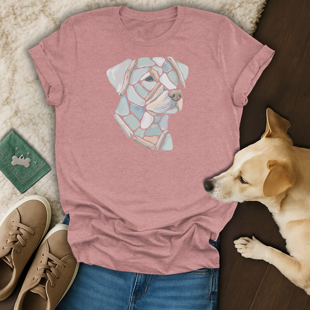 Pink t-shirt with a dog's head mosaic graphic, displayed with jeans and sneakers.