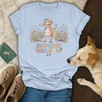 Light blue t-shirt with colorful dog wearing apron and hat holding shovel, "Digging Season" text.