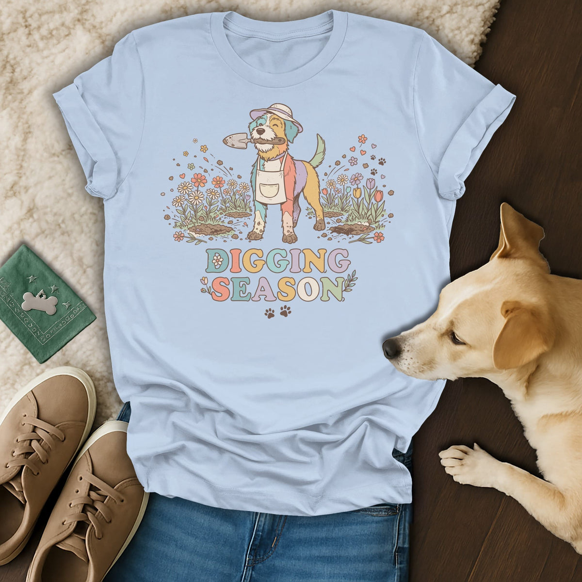 Light blue t-shirt with colorful dog wearing apron and hat holding shovel, "Digging Season" text.