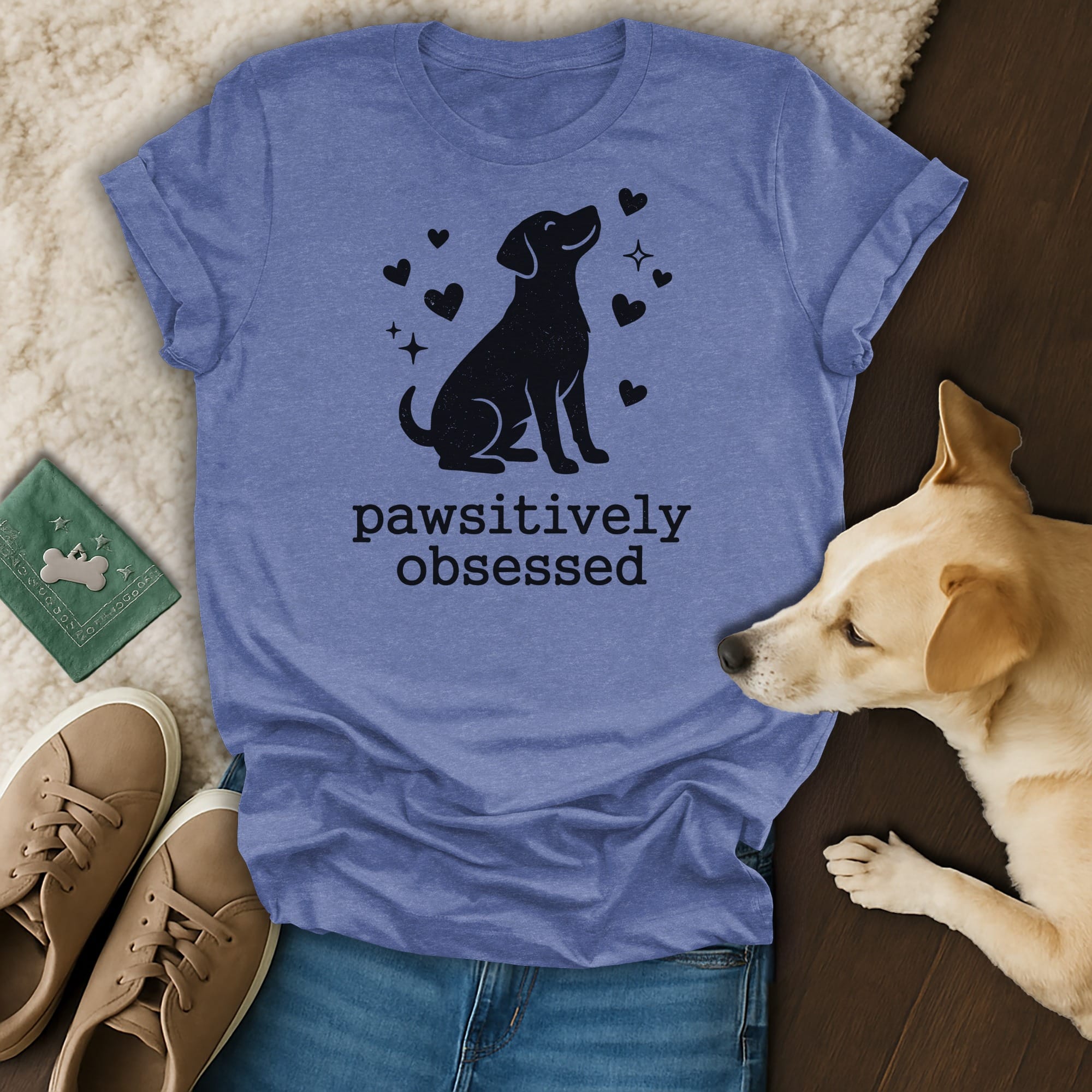 Blue t-shirt with black dog silhouette and "pawsitively obsessed" text.