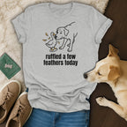Grey t-shirt with a line drawing of a dog and duck, saying "ruffled a few feathers today."