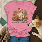 Pink t-shirt featuring a Jack Russell terrier graphic with garden illustrations and text reading GARDEN ASSISTANT.