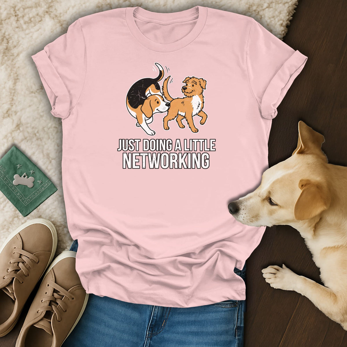 Pink t-shirt with graphic of two dogs and text "JUST DOING A LITTLE NETWORKING".