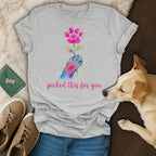 Pink paw print flower held by a watercolor hand, "picked this for you" text.