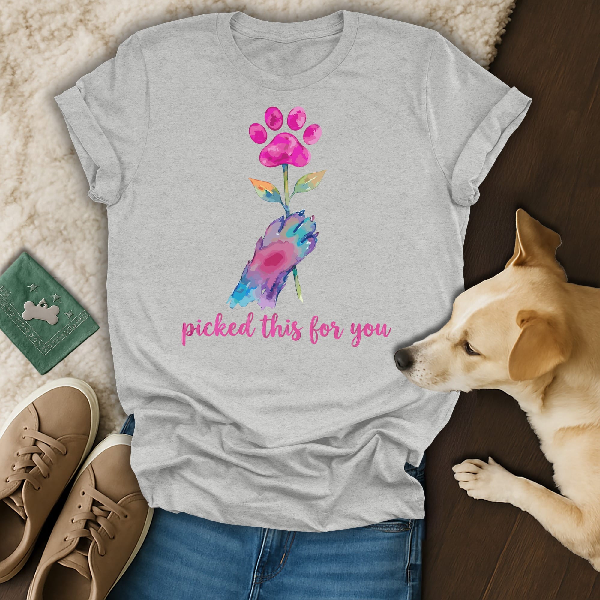 Pink paw print flower held by a watercolor hand, "picked this for you" text.