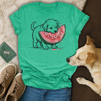 Puppy wearing a t-shirt with a watermelon design, next to a real dog.