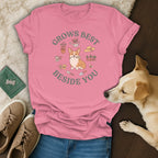 Pink t-shirt with a corgi gardening graphic and the text Grows Best Beside You.