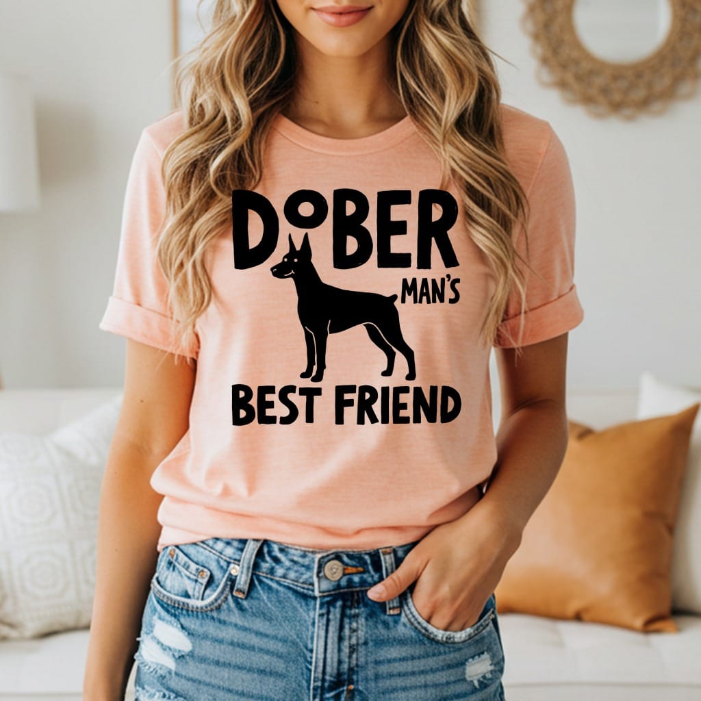 Doberman Man's Best Friend graphic on a peach t-shirt.