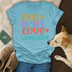 T-shirt with "DOG IS MY LOVE LANGUAGE" in colorful text.
