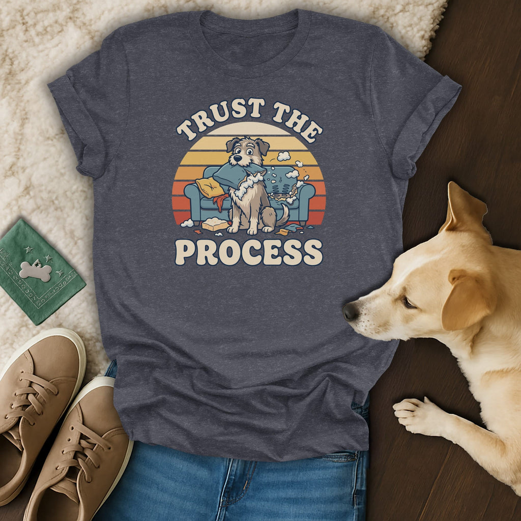 Dark grey t-shirt with a graphic of a dog on a messy couch, reading "Trust the Process".