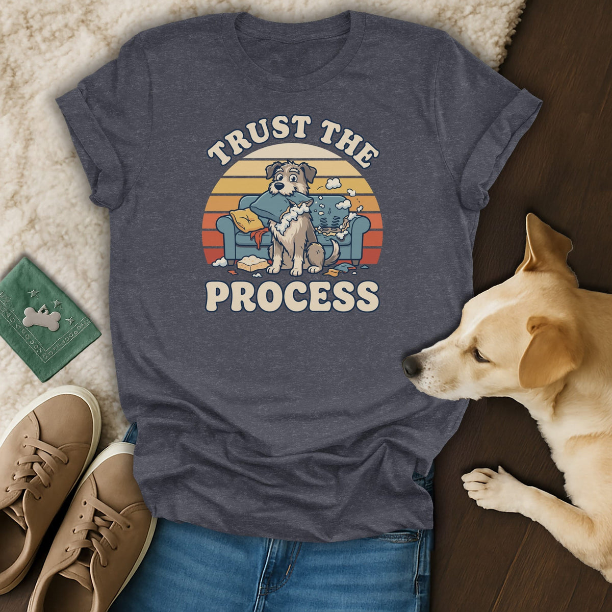 Dark grey t-shirt with a graphic of a dog on a messy couch, reading "Trust the Process".