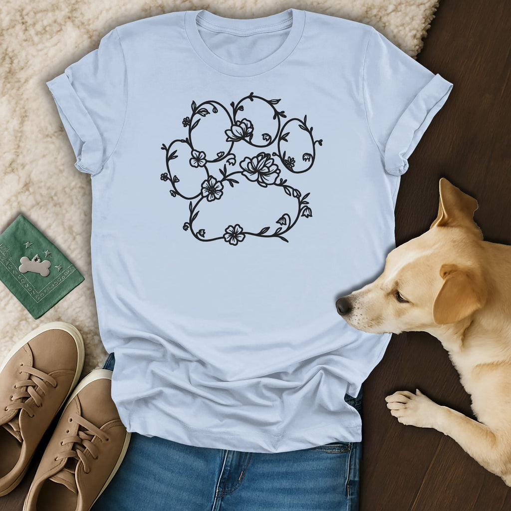 Light blue t-shirt with floral paw print design, dog and shoes.