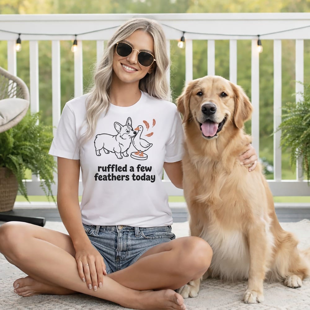 White t-shirt with a corgi and duck graphic reading "ruffled a few feathers today."