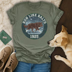 T-shirt with "Run Like Balto 1925" text and dog illustration.